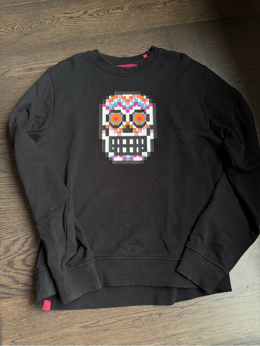 Mostly Heard Rarely Seen Black Crewneck Sweater with Multicolor Pixel Skull